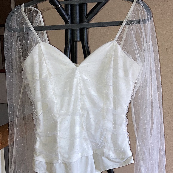 White bodysuit with dotted mesh sleeves. - Picture 3 of 5